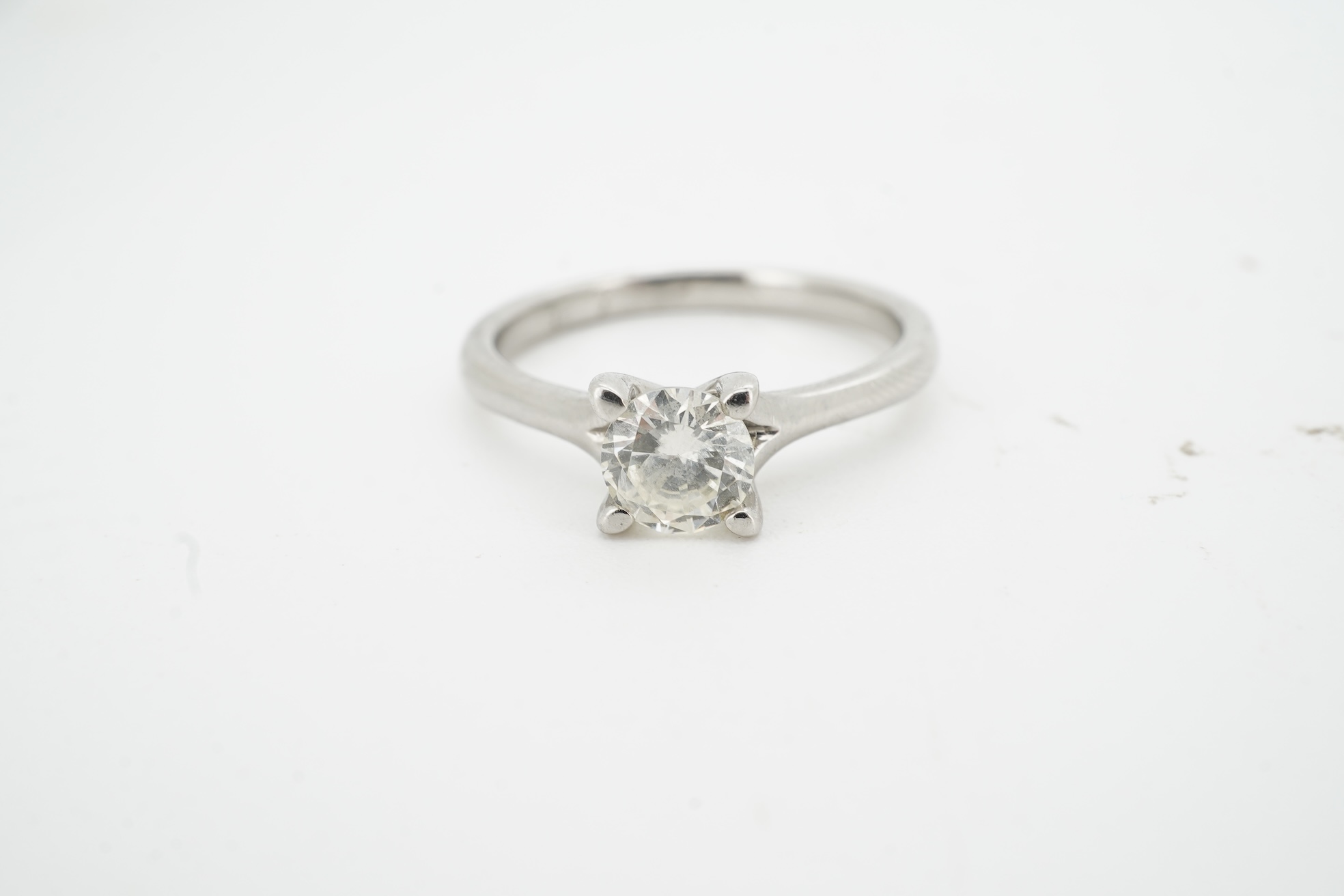 A diamond ring, claw-set with a brilliant-cut diamond weighing approximately 0.50 carats, mounted in platinum, size K, British hallmarks, gross weight approximately 4 grams